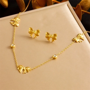 Golden stainless steel bow jewelry set with zircon necklace and stud earrings