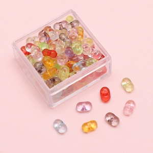 Colorful 4x6mm acrylic peanut beads for DIY jewelry making in a clear storage box