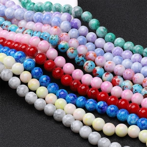 Macro shot of 8mm colorful marble and splash ink patterned glass beads for DIY jewelry