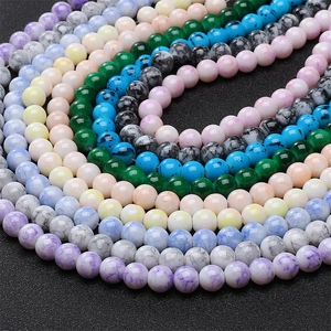 Macro shot of 8mm colorful cracked glass beads arranged in a spiral for DIY jewelry making