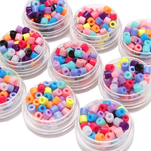 Colorful 4mm acrylic cylinder beads in round clear containers for DIY jewelry making