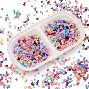 Overhead view of colorful 4mm acrylic cylinder beads for DIY jewelry and crafts