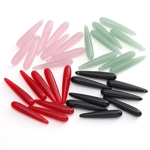Detailed view of assorted resin jade teardrop beads for DIY jewelry making and earrings