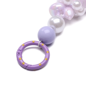 Detail of 25mm purple polka dot spring ring with assorted pearls for DIY keychains