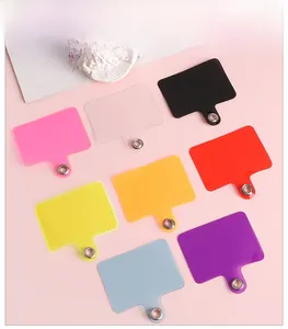 Detailed display of 8 colorful universal phone lanyard tether tabs with metal eyelets