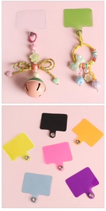 Detailed view of colorful phone lanyard patches and sweet style decorative beaded pendants