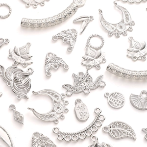 Detailed silver alloy jewelry charms featuring Chinese auspicious motifs and intricate carvings