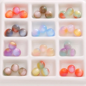 8mm colorful gradient resin beads with cat eye effect arranged in a sorting tray