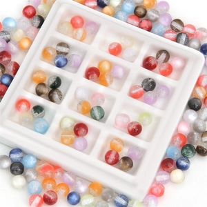 Colorful resin glitter round beads set in white grid tray for DIY jewelry making