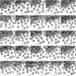 Detail of silver acrylic A-Z alphabet beads with black engraved letters for jewelry DIY