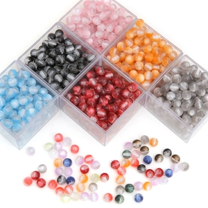 DIY colorful resin beads set with glitter finish in a transparent storage box for jewelry