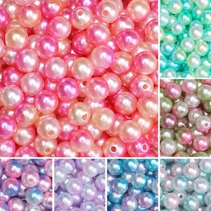 Macro detail of mixed color ABS round pearls with hole for DIY jewelry making