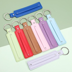 Minimalist leather keychain straps in eight vibrant colors with premium metal key rings