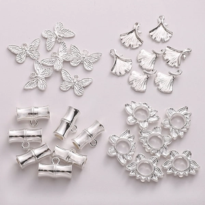 Silver alloy jewelry accessories featuring butterfly, ginkgo leaf, and bamboo charms for DIY