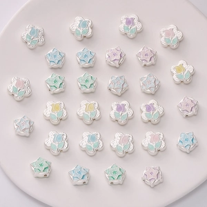 Macro detail of tulip flower charms with macaron enamel finish for DIY jewelry
