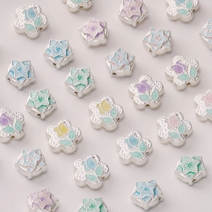 Macro detail of tulip flower charms with colorful enamel finish for DIY jewelry making