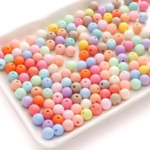 Macro detail of multi-color matte acrylic round beads for DIY jewelry making and crafts