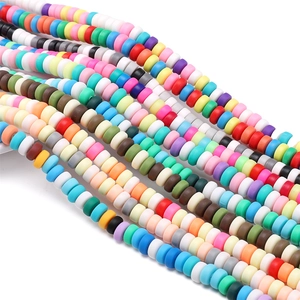Close-up of colorful 6x3mm flat clay heishi beads for DIY handmade jewelry crafts
