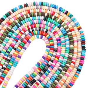 Macro view of multi-colored 6x3mm flat heishi beads made of polymer clay for DIY jewelry