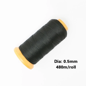Close-up of 0.5mm black braided nylon thread on orange spool, 480m roll for jewelry DIY