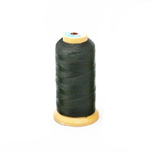 Detail of high-strength black braided nylon thread spool for jewelry and leather sewing