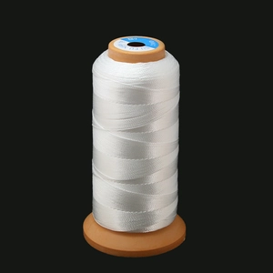 Macro shot of high-quality white 210D 6-strand nylon thread spool for leather sewing
