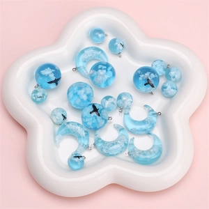 Blue sky resin charms with clouds and birds in spherical and crescent shapes for DIY jewelry