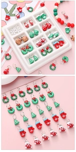 Macro shot of assorted Christmas enamel alloy charms with Santa and reindeer motifs