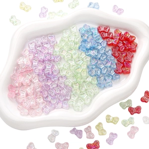 Colorful AB coated acrylic butterfly beads for DIY jewelry making on white tray