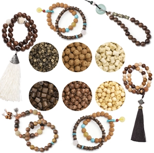 Detail of natural wood prayer beads with tassels and traditional Chinese ethnic accessories