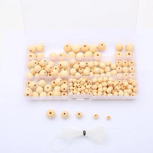 Macro detail of various natural wood beads kit with clear storage box and elastic cord