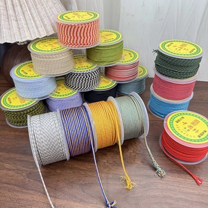 Close-up of multicolored 2mm nylon cord spools for DIY jewelry weaving and crafts