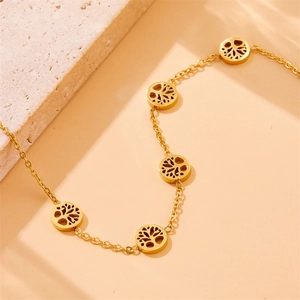 Golden stainless steel necklace featuring hollow tree of life pendants on a fine chain