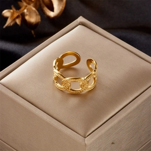 Detailed view of adjustable gold-plated chain ring with retro textured link patterns