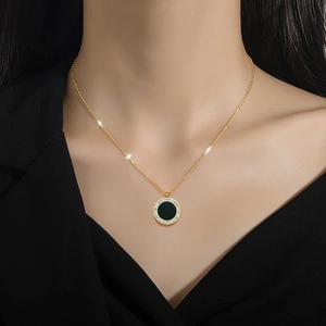 Titanium steel necklace featuring a round black agate pendant with gold finish and crystals