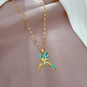 Gold stainless steel hummingbird necklace with blue enamel and rhinestone detail