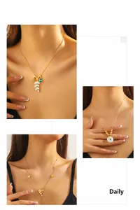 Three gold-plated stainless steel necklaces with gemstone pendants shown on a model