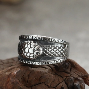 Vintage stainless steel snake ring with textured scales and punk gothic carved design