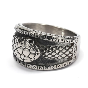 Detailed macro view showing the snakeskin texture and gothic design of the steel ring