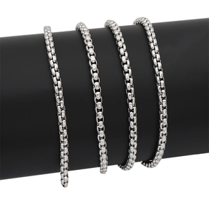 Polished silver stainless steel box chain necklace for men shown on a black display stand