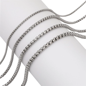 Polished silver stainless steel box chains in four sizes wrapped on a white display
