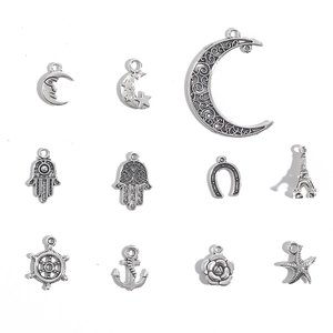Set of 11 vintage silver alloy charms with moon, hamsa, and anchor for DIY jewelry
