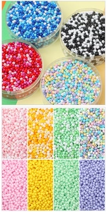Macro shot of 2mm and 3mm round glass beads in multiple color palettes for DIY jewelry