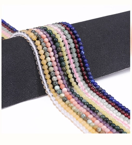 Detailed macro shot of 6mm polished natural gemstone beads in various colors for jewelry