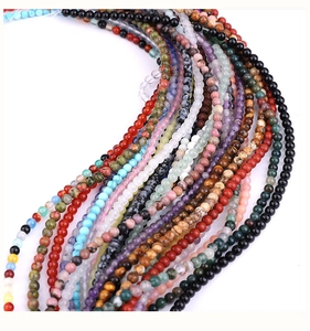 Macro shot of colorful natural stone beads with polished texture for jewelry making