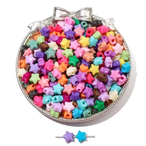 Colorful star-shaped acrylic beads for DIY bracelets shown in a decorative silver tray