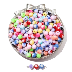 Macro view of colorful acrylic heart beads with marble texture for DIY jewelry making