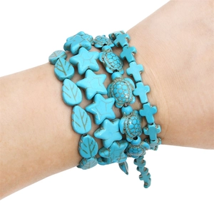 Bohemian synthetic turquoise beaded bracelet set with leaf, star, turtle and cross charms