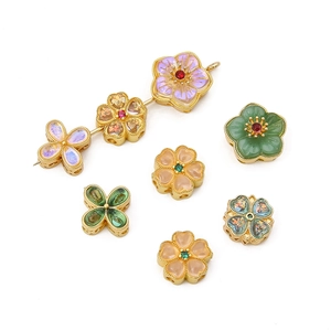 Gold-plated cherry blossom and clover jewelry charms in assorted vibrant colors