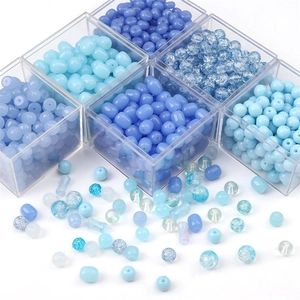 Assorted blue DIY beads in glass material featuring crackle texture and various shapes